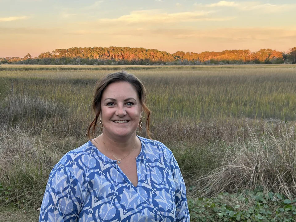 Kim Cunningham beside the Lowcountry marsh at sunset
